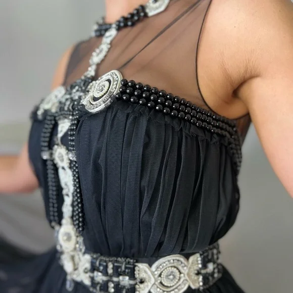 Naeem Khan gown embellished with allover embroidery Round neckline; open back